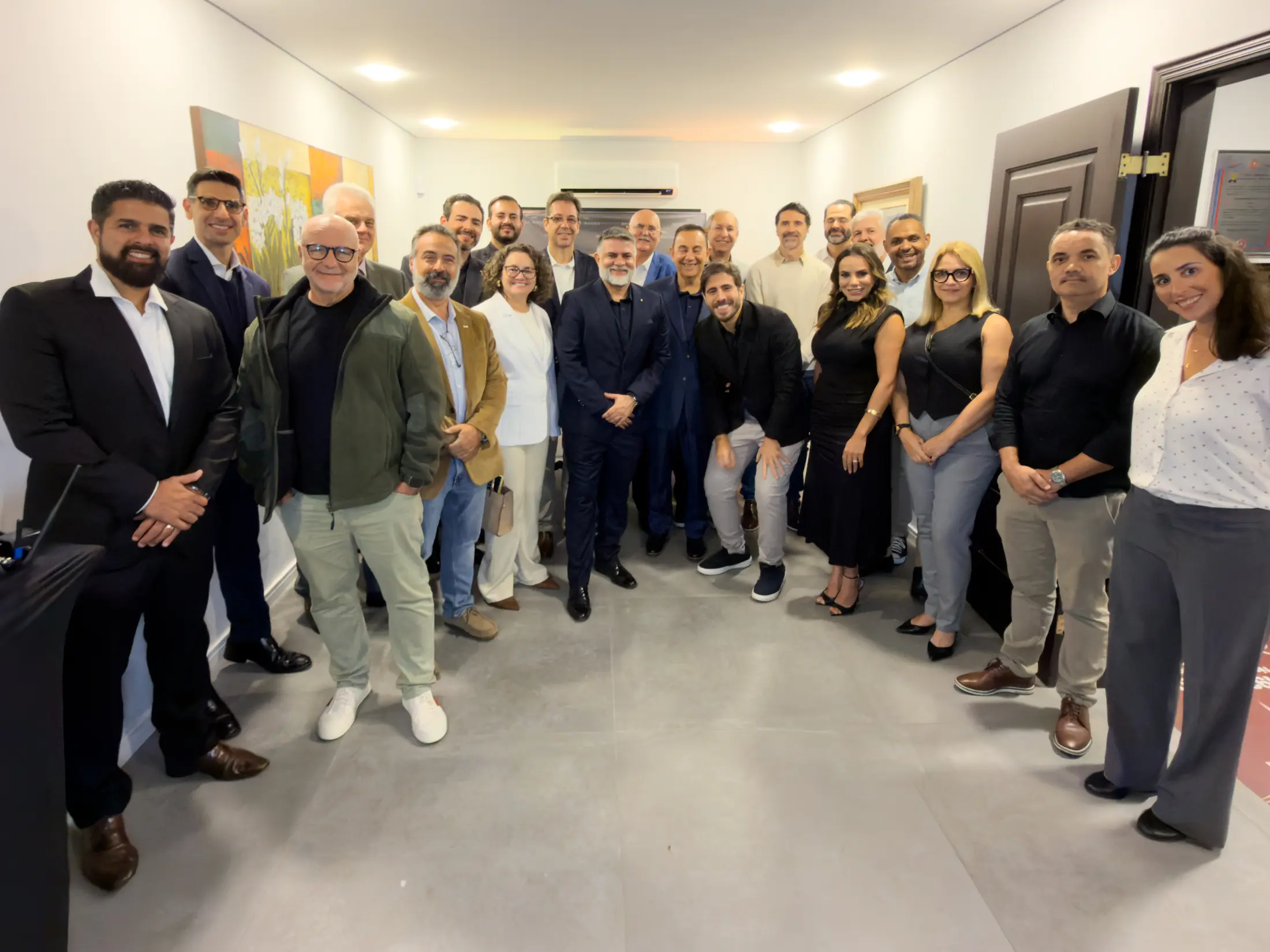 Grupo reunido durante evento corporativo na sede do Clube
